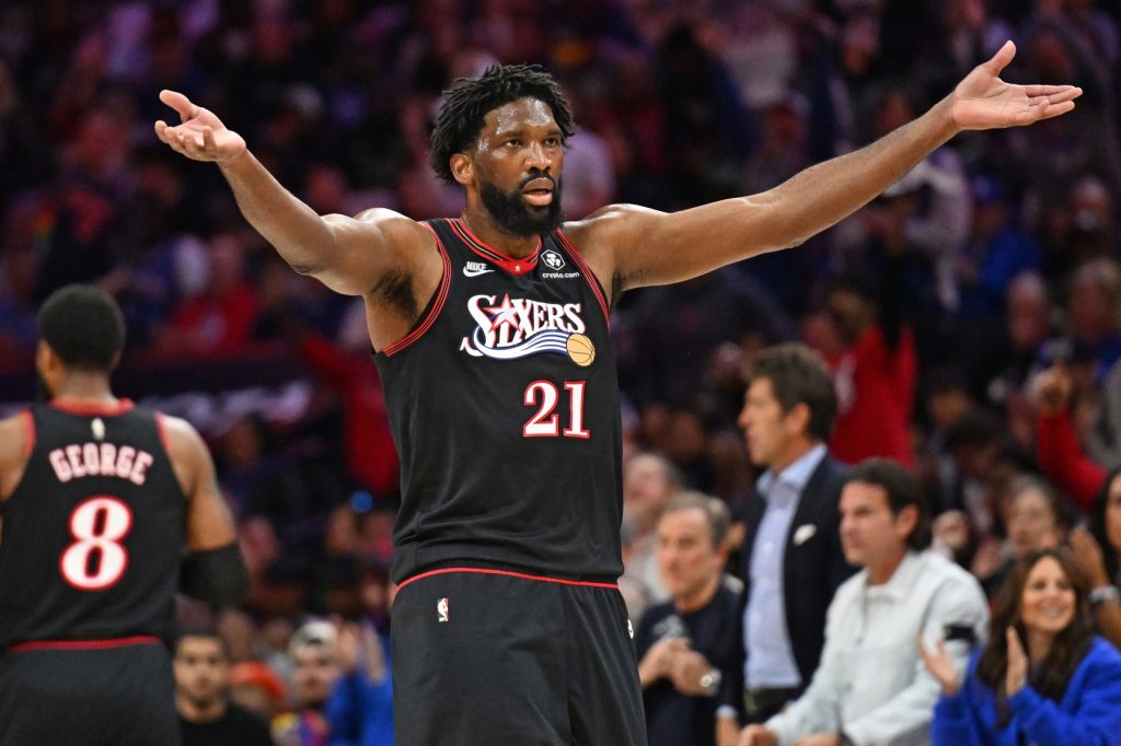 Apr 26, 2026; Philadelphia, Pennsylvania, USA; Philadelphia 76ers center Joel Embiid (21) encourages the crowd against the Boston Celtics during the first half at Xfinity Mobile Arena.