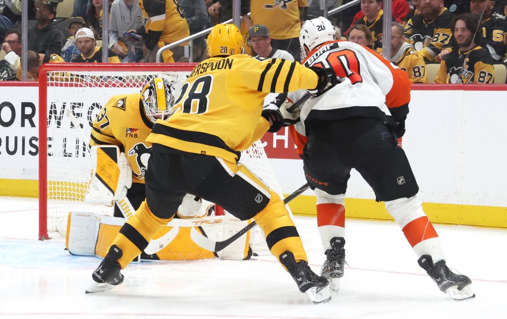 Apr 27, 2026; Pittsburgh, Pennsylvania, USA; Philadelphia Flyers left wing Alex Bump (20) scores a gaol against Pittsburgh Penguins goaltender Arturs Silovs (37) as Penguins defenseman Parker Wotherspoon (28) defends during the second period in game five of the first round of the 2026 Stanley Cup Playoffs at PPG Paints Arena.