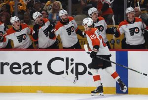 Apr 27, 2026; Pittsburgh, Pennsylvania, USA; Philadelphia Flyers left wing Alex Bump (20) celebrates his goal with the Flyers bench against the Pittsburgh Penguins during the second period in game five of the first round of the 2026 Stanley Cup Playoffs at PPG Paints Arena.