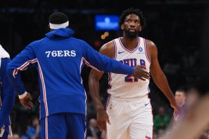 Apr 28, 2026; Boston, Massachusetts, USA; Philadelphia 76ers center Joel Embiid (21) checks the board during a break against the Boston Celtics in the first quarter during game five of the first round of the 2026 NBA Playoffs at TD Garden.