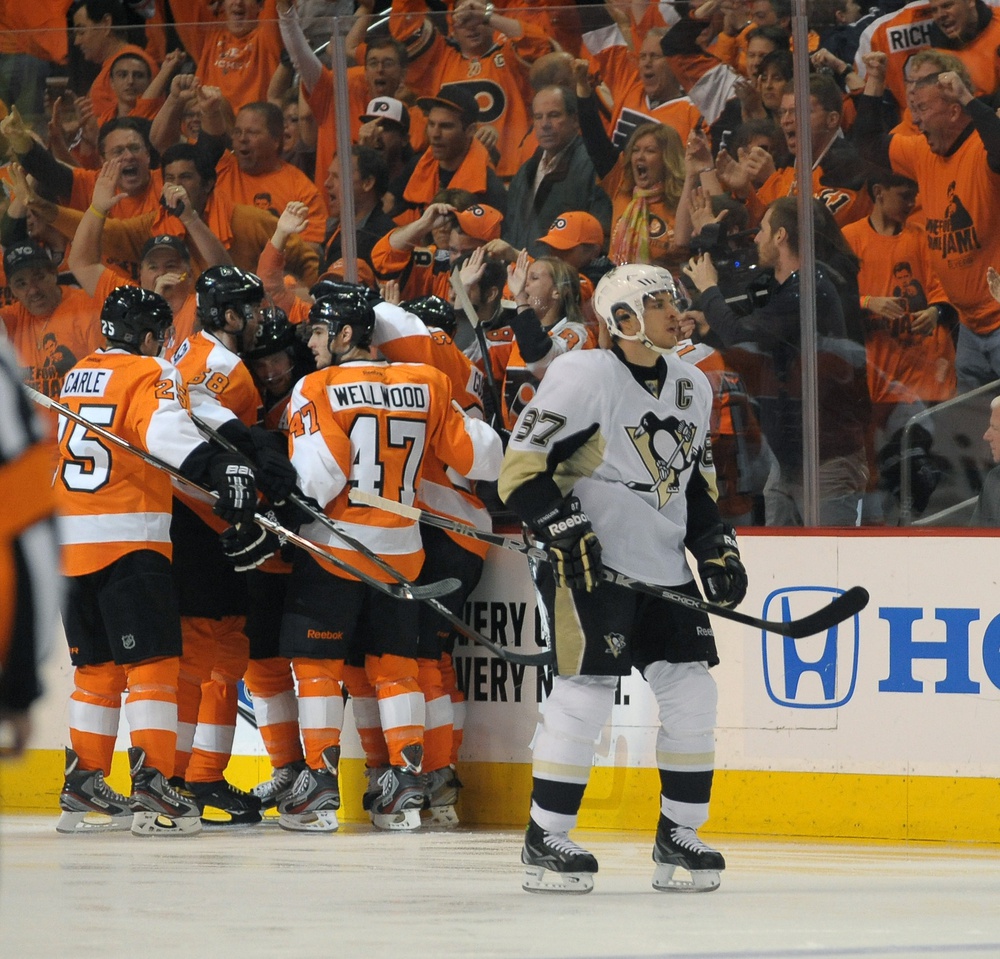 April 22, 2012; Philadelphia, PA, USA; Philadelphia Flyers center Claude Giroux (28) celebrates his goal with teammates as Pittsburgh Penguins center Sidney Crosby (87) skates by during 1st period of game six of the 2012 Eastern Conference quarterfinals at Wells Fargo Center.