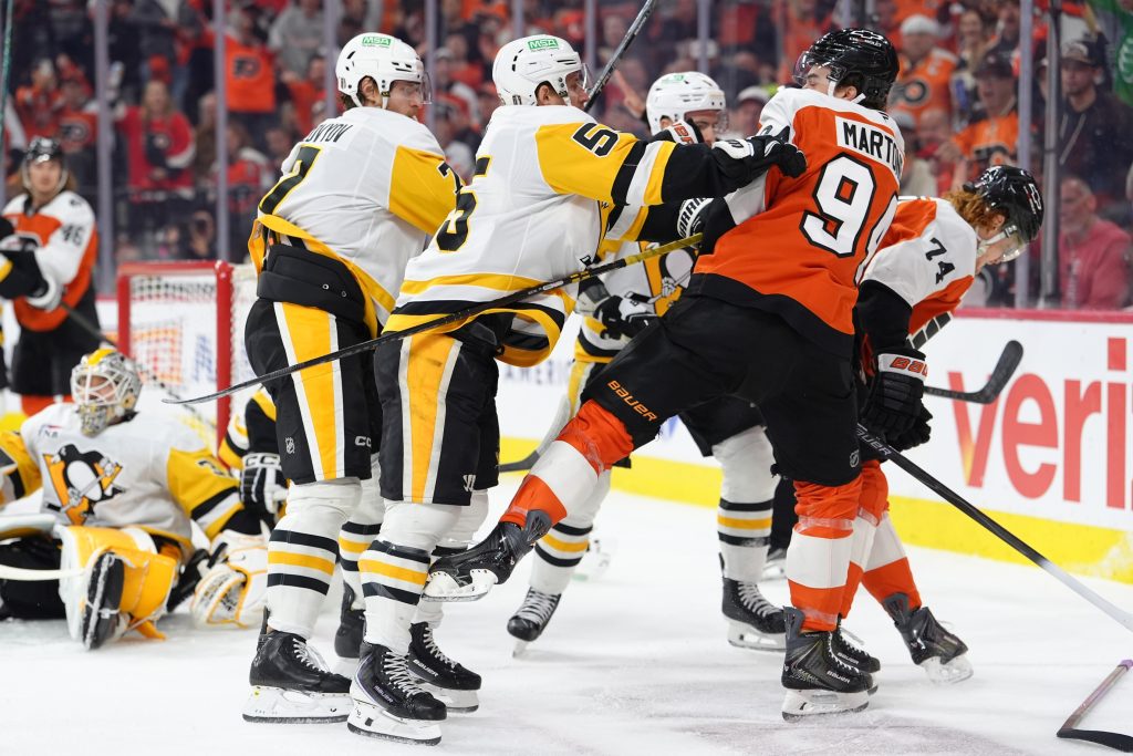 Apr 29, 2026; Philadelphia, Pennsylvania, USA; Pittsburgh Penguins center Noel Acciari (55) hits Philadelphia Flyers right wing Porter Martone (94) in the first period in game six of the first round of the 2026 Stanley Cup Playoffs at Xfinity Mobile Arena.