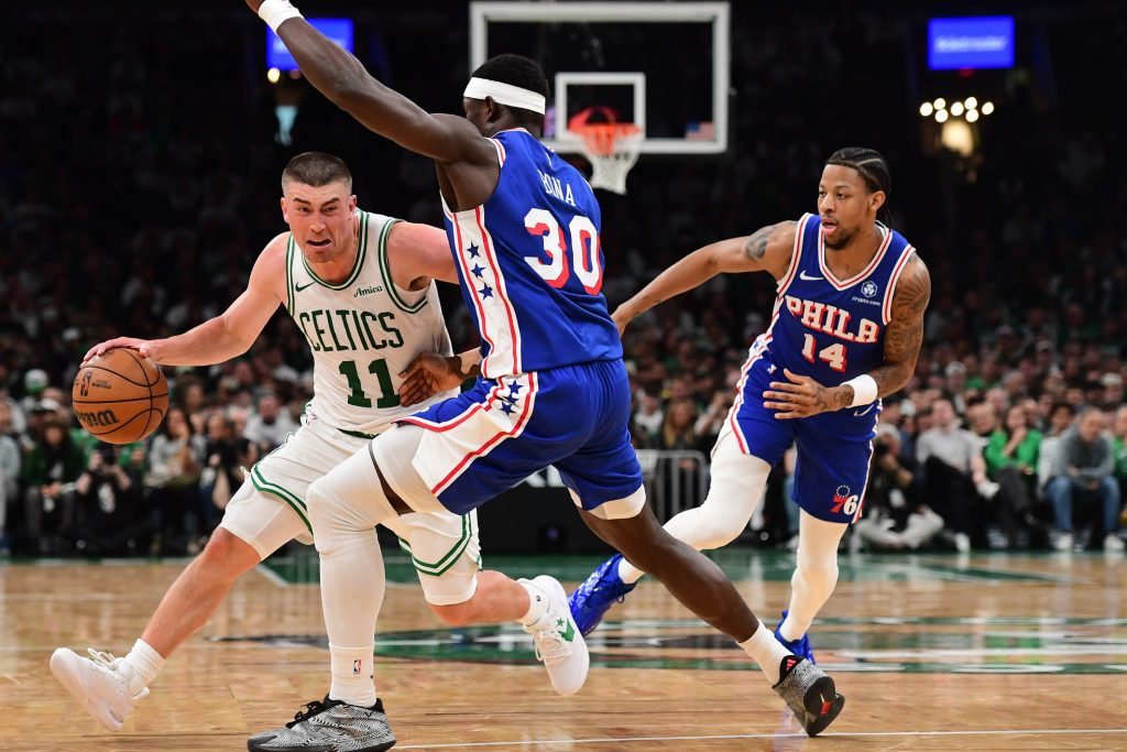 Apr 19, 2026; Boston, Massachusetts, USA; Philadelphia 76ers center Adem Bona (30) defends Boston Celtics guard Payton Pritchard (11) in the second half during game one of the first round of the 2026 NBA Playoffs at TD Garden.