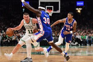 Apr 19, 2026; Boston, Massachusetts, USA; Philadelphia 76ers center Adem Bona (30) defends Boston Celtics guard Payton Pritchard (11) in the second half during game one of the first round of the 2026 NBA Playoffs at TD Garden.