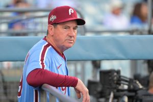 Oct 8, 2025; Los Angeles, California, USA; Philadelphia Phillies manager Rob Thomson (49) looks on before the game against the Los Angeles Dodgers during game three of the NLDS round for the 2025 MLB playoffs at Dodger Stadium.