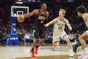 Apr 12, 2026; Philadelphia, Pennsylvania, USA; Philadelphia 76ers guard Tyrese Maxey (0) controls the ball against Milwaukee Bucks guard AJ Green (20) in the third quarter at Xfinity Mobile Arena.