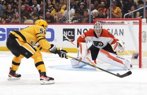 Apr 20, 2026; Pittsburgh, Pennsylvania, USA; Philadelphia Flyers goaltender Dan Vladar (80) defends the net against Pittsburgh Penguins right wing Egor Chinakhov (59) during the third period in game two of the first round of the 2026 Stanley Cup Playoffs at PPG Paints Arena.