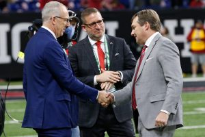 SEC Commissioner Greg Sankey shakes hands with Georgia coach Kirby Smart at Lucas Oil Stadium before the College Football Playoff National Championship game in Indianapolis, on Monday, Jan. 10, 2022. News Joshua L Jones