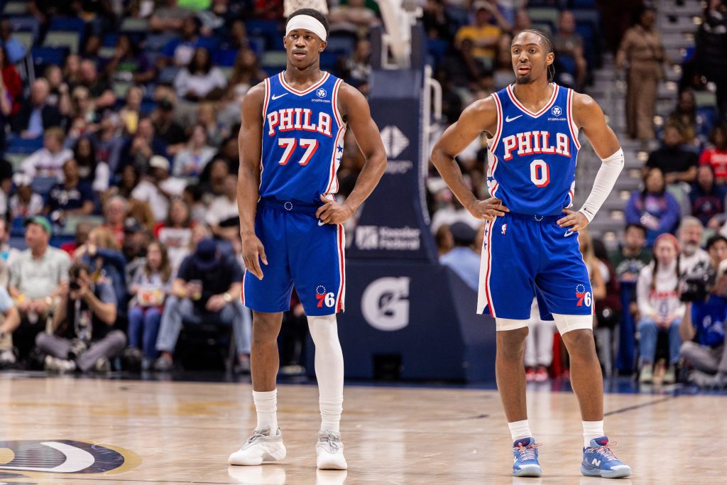 Feb 21, 2026; New Orleans, Louisiana, USA; Philadelphia 76ers guard Vj Edgecombe (77) and guard Tyrese Maxey (0) looks on against the New Orleans Pelicans during the first half at Smoothie King Center.