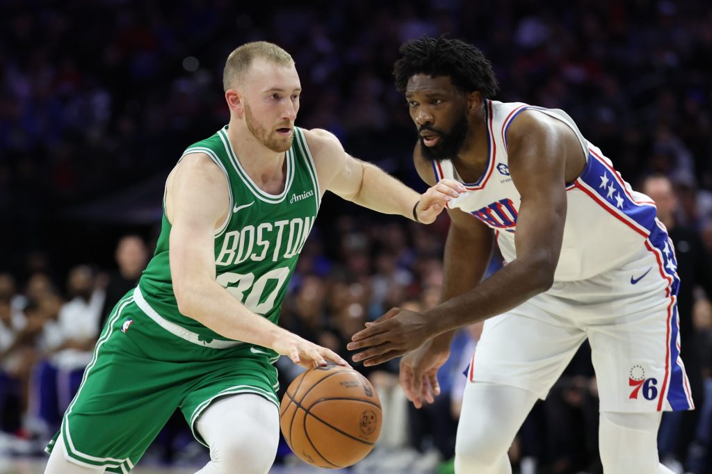 Apr 30, 2026; Philadelphia, Pennsylvania, USA; Boston Celtics forward Sam Hauser (30) drives against Philadelphia 76ers center Joel Embiid (21) during the first quarter at Xfinity Mobile Arena.