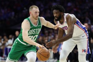 Apr 30, 2026; Philadelphia, Pennsylvania, USA; Boston Celtics forward Sam Hauser (30) drives against Philadelphia 76ers center Joel Embiid (21) during the first quarter at Xfinity Mobile Arena.
