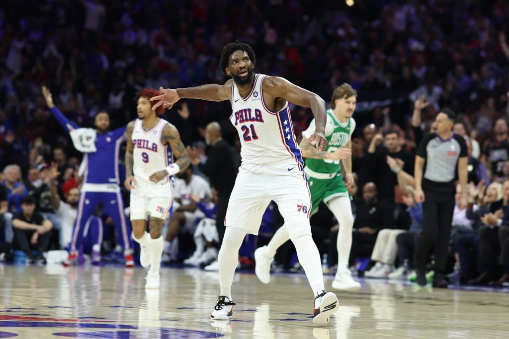 Apr 30, 2026; Philadelphia, Pennsylvania, USA; Philadelphia 76ers center Joel Embiid (21) reacts after his three pointer against the Boston Celtics during the second quarter at Xfinity Mobile Arena.