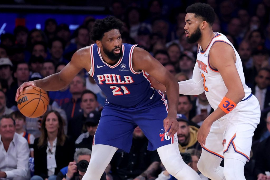 May 4, 2026; New York, New York, USA; Philadelphia 76ers center Joel Embiid (21) controls the ball against New York Knicks center Karl-Anthony Towns (32) during the first quarter of game one of the eastern conference semifinal round of the 2026 NBA Playoffs at Madison Square Garden.
