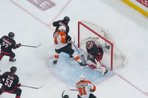 May 4, 2026; Raleigh, North Carolina, USA; Carolina Hurricanes goaltender Frederik Andersen (31) stops the shot against Philadelphia Flyers center Sean Couturier (14) during the first period in game two of the second round of the 2026 Stanley Cup Playoffs at Lenovo Center.