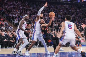 May 6, 2026; New York, New York, USA; New York Knicks guard Miles McBride (2) looks to drive past Philadelphia 76ers forward Paul George (8) during game five of the second round of the 2026 NBA Playoffs at Madison Square Garden.