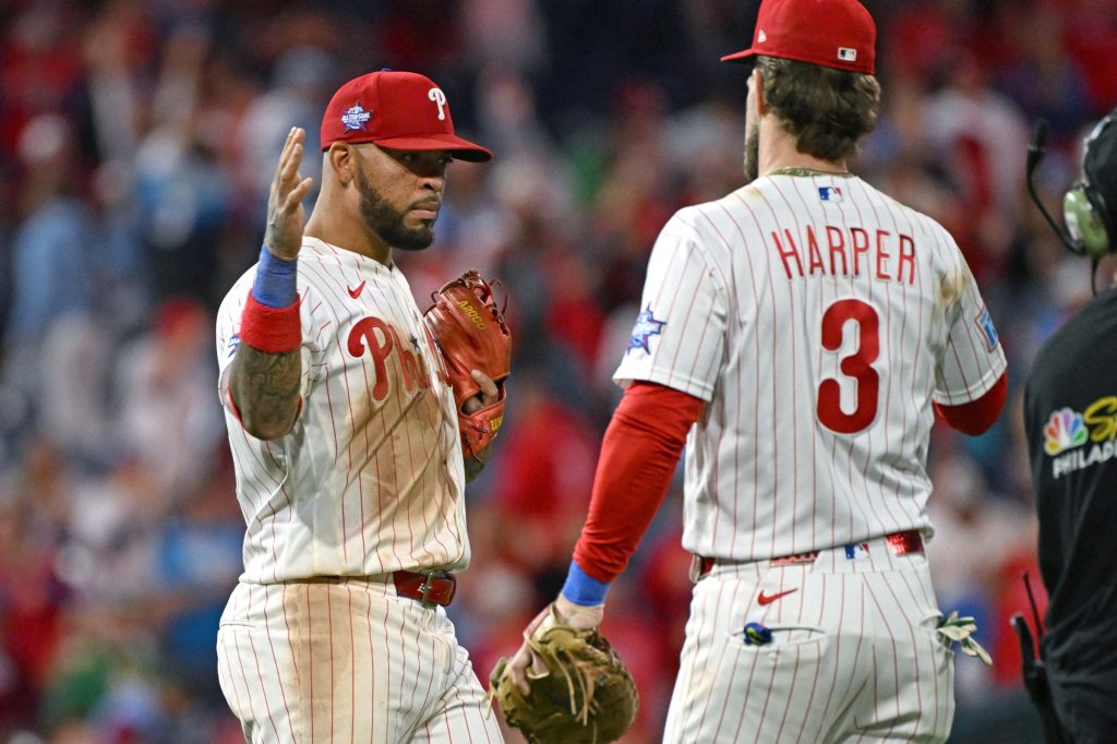 May 6, 2026; Philadelphia, Pennsylvania, USA; Philadelphia Phillies second baseman Edmundo Sosa (33) celebrates win with first baseman Bryce Harper (3) against the Athletics at Citizens Bank Park.