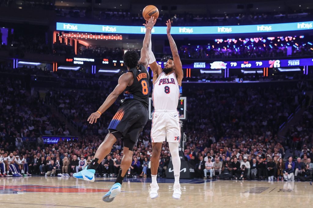 May 6, 2026; New York, New York, USA; Philadelphia 76ers forward Paul George (8) takes a three point shot past New York Knicks forward Og Anunoby (8) during game five of the second round of the 2026 NBA Playoffs at Madison Square Garden.