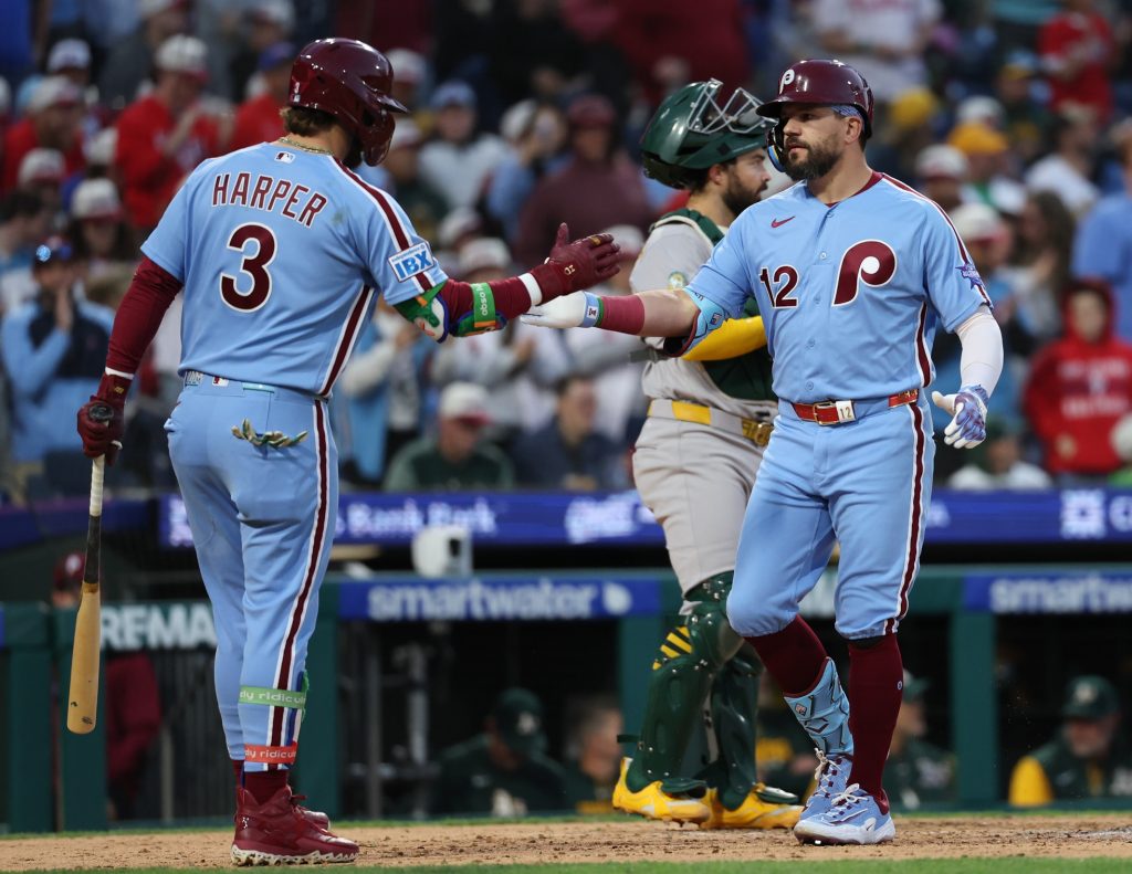 May 7, 2026; Philadelphia, Pennsylvania, USA; Philadelphia Phillies left fielder Kyle Schwarber (12) is congratulated by first baseman Bryce Harper (3) after hitting a home run against the Athletics at Citizens Bank Park.