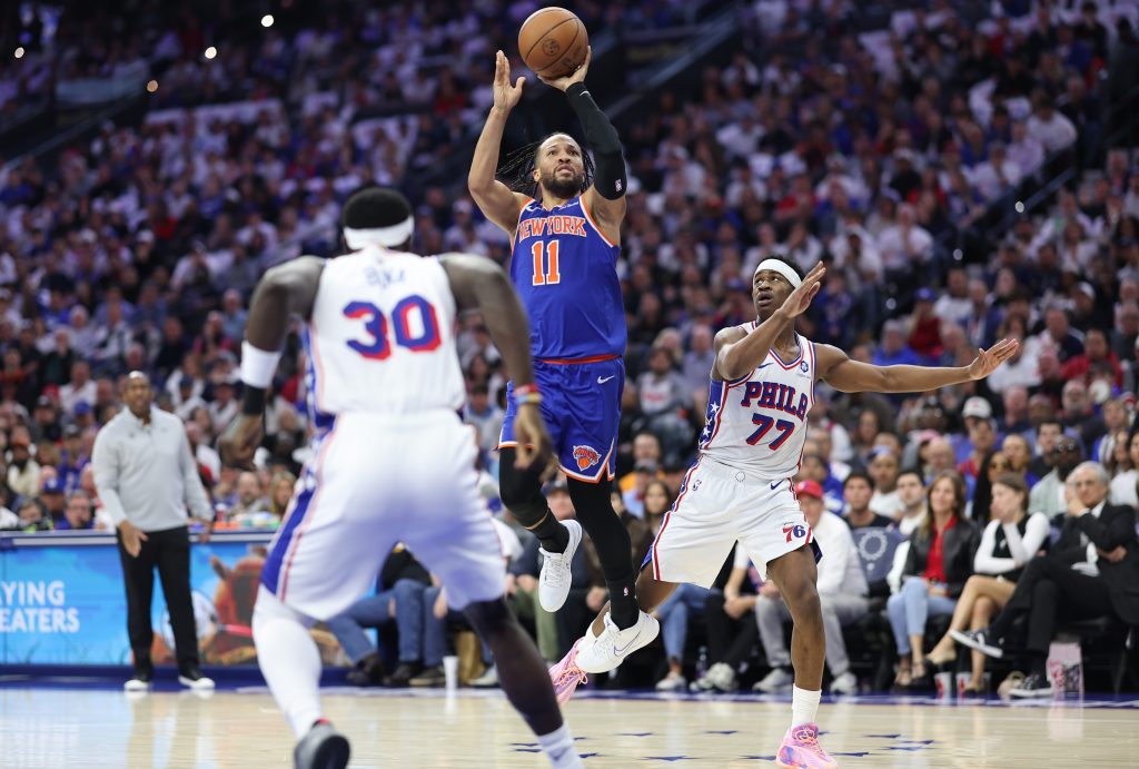 May 8, 2026; Philadelphia, Pennsylvania, USA; New York Knicks guard Jalen Brunson (11) shoots in front of Philadelphia 76ers guard Vj Edgecombe (77) during the second quarter of game three of the second round of the 2026 NBA Playoffs at Xfinity Mobile Arena.