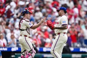 May 10, 2026; Philadelphia, Pennsylvania, USA; Philadelphia Phillies catcher J.T. Realmuto (10) and pitcher Jhoan Duran (59) slap hands after winning against the Colorado Rockies at Citizens Bank Park.