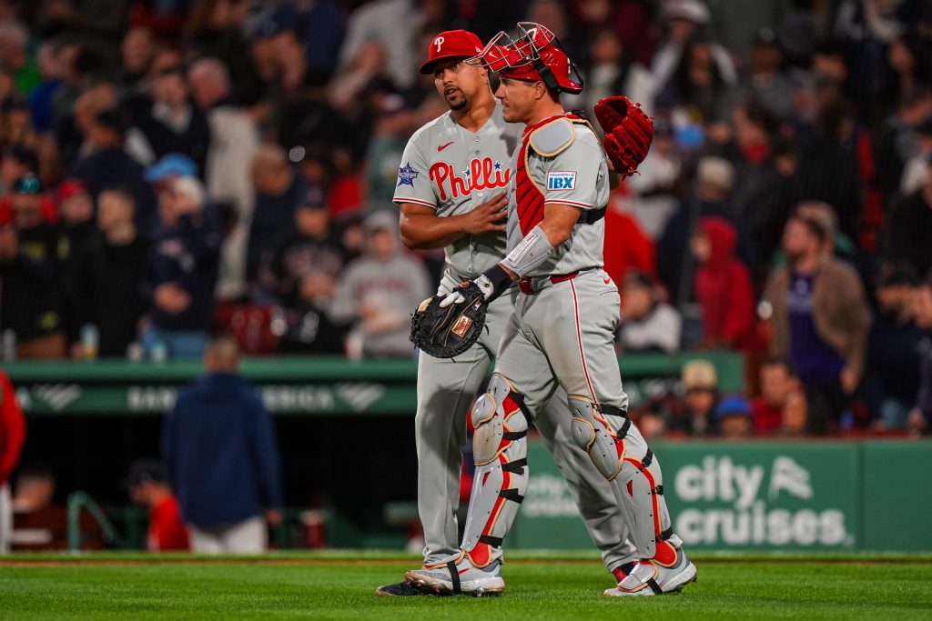 May 12, 2026; Boston, Massachusetts, USA; Philadelphia Phillies pitcher Jhoan Duran (59) and catcher J.T. Realmuto (10) react after defeating the Boston Red Sox at Fenway Park.