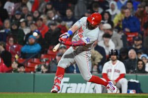 May 14, 2026; Boston, Massachusetts, USA; Philadelphia Phillies designated hitter Kyle Schwarber (12) hits a two run home run during the eighth inning against the Boston Red Sox at Fenway Park.