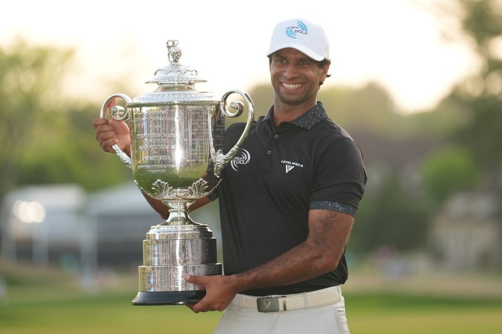 May 17, 2026; Newtown Square, Pennsylvania, USA; Aaron Rai reacts with the trophy after winning the final round of the PGA Championship golf tournament.