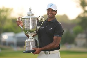 May 17, 2026; Newtown Square, Pennsylvania, USA; Aaron Rai reacts with the trophy after winning the final round of the PGA Championship golf tournament.