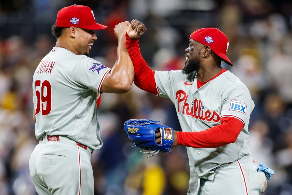 May 26, 2026; San Diego, California, USA; Philadelphia Phillies relief pitcher Jhoan Duran (59) celebrates wtih right fielder Adolis García (53) after defeating the San Diego Padres at Petco Park.