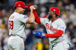 May 26, 2026; San Diego, California, USA; Philadelphia Phillies relief pitcher Jhoan Duran (59) celebrates wtih right fielder Adolis García (53) after defeating the San Diego Padres at Petco Park.
