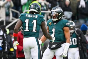 Dec 14, 2025; Philadelphia, Pennsylvania, USA; Philadelphia Eagles wide receiver A.J. Brown (11) and quarterback Jalen Hurts (1) celebrate after scoring a touchdown during the third quarter against the Las Vegas Raiders at Lincoln Financial Field.
