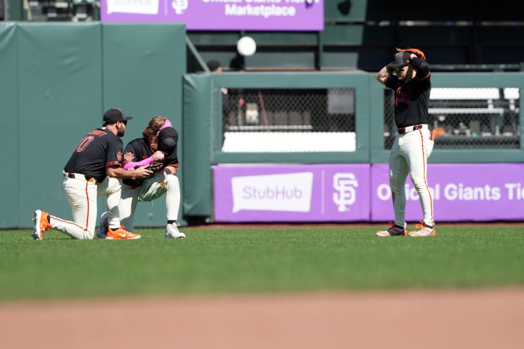 May 23, 2026; San Francisco, California, USA; San Francisco Giants left fielder Casey Schmitt (left) and center fielder Harrison Bader (center left) celebrates with right fielder Drew Gilbert (right) after defeating the Chicago White Sox at Oracle Park.