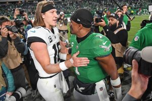 Nov 3, 2024; Philadelphia, Pennsylvania, USA; Jacksonville Jaguars quarterback Trevor Lawrence (16) and Philadelphia Eagles quarterback Jalen Hurts (1) meet on the field after the game at Lincoln Financial Field.