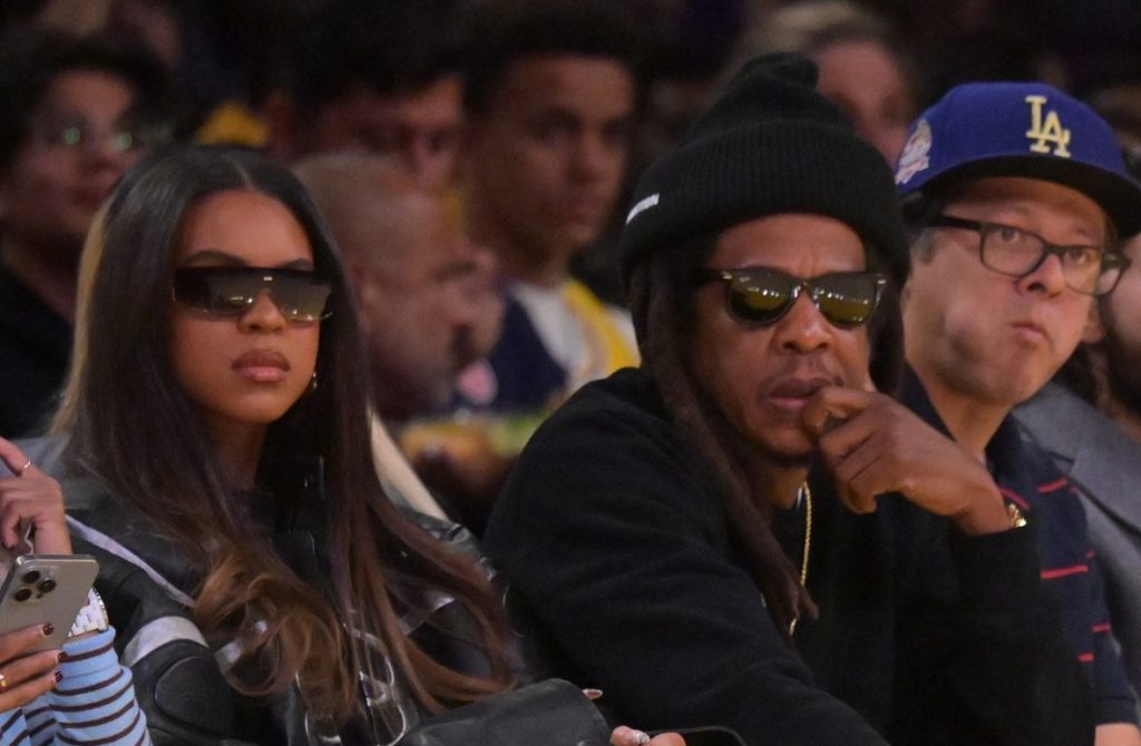 Dec 10, 2025; Los Angeles, California, USA; Blue Ivy Carter with her dad rapper Jay-Z as they attend the game between the Los Angeles Lakers and the San Antonio Spurs at Crypto.com Arena.