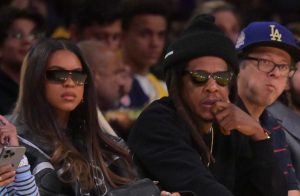 Dec 10, 2025; Los Angeles, California, USA; Blue Ivy Carter with her dad rapper Jay-Z as they attend the game between the Los Angeles Lakers and the San Antonio Spurs at Crypto.com Arena.