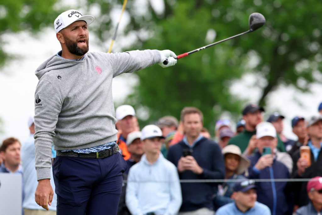 May 14, 2026; Newtown Square, Pennsylvania, USA; Jon Rahm reacts to his shot from the 12th tee during the first round of the PGA Championship golf tournament at Aronimink Golf Club.