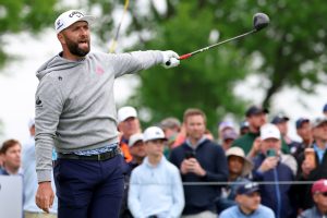May 14, 2026; Newtown Square, Pennsylvania, USA; Jon Rahm reacts to his shot from the 12th tee during the first round of the PGA Championship golf tournament at Aronimink Golf Club.