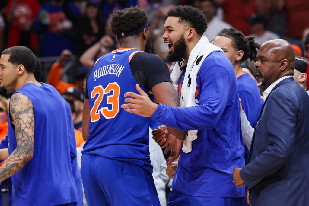 Apr 30, 2026; Atlanta, Georgia, USA; New York Knicks center Mitchell Robinson (23) talks to center Karl-Anthony Towns (32) after an altercation with Atlanta Hawks guard Dyson Daniels (not pictured) in the second quarter during game six of the first round of the 2026 NBA Playoffs at State Farm Arena.
