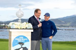 February 2, 2025; Pebble Beach, California, USA; CBS broadcaster Jim Nantz (left) interviews Rory McIlroy (right) during the final round of the AT&T Pebble Beach Pro-Am golf tournament at Pebble Beach Golf Links.