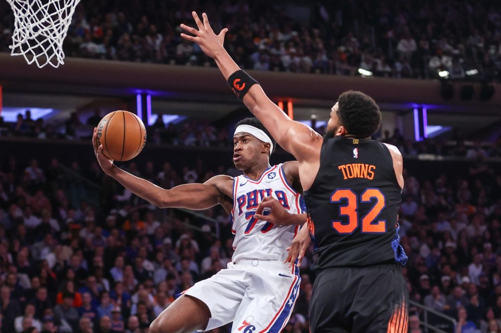 May 6, 2026; New York, New York, USA; Philadelphia 76ers guard Vj Edgecombe (77) drives past New York Knicks center Karl-Anthony Towns (32) during game five of the second round of the 2026 NBA Playoffs at Madison Square Garden.
