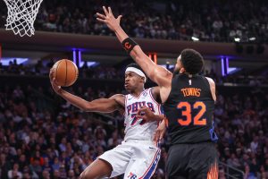 May 6, 2026; New York, New York, USA; Philadelphia 76ers guard Vj Edgecombe (77) drives past New York Knicks center Karl-Anthony Towns (32) during game five of the second round of the 2026 NBA Playoffs at Madison Square Garden.