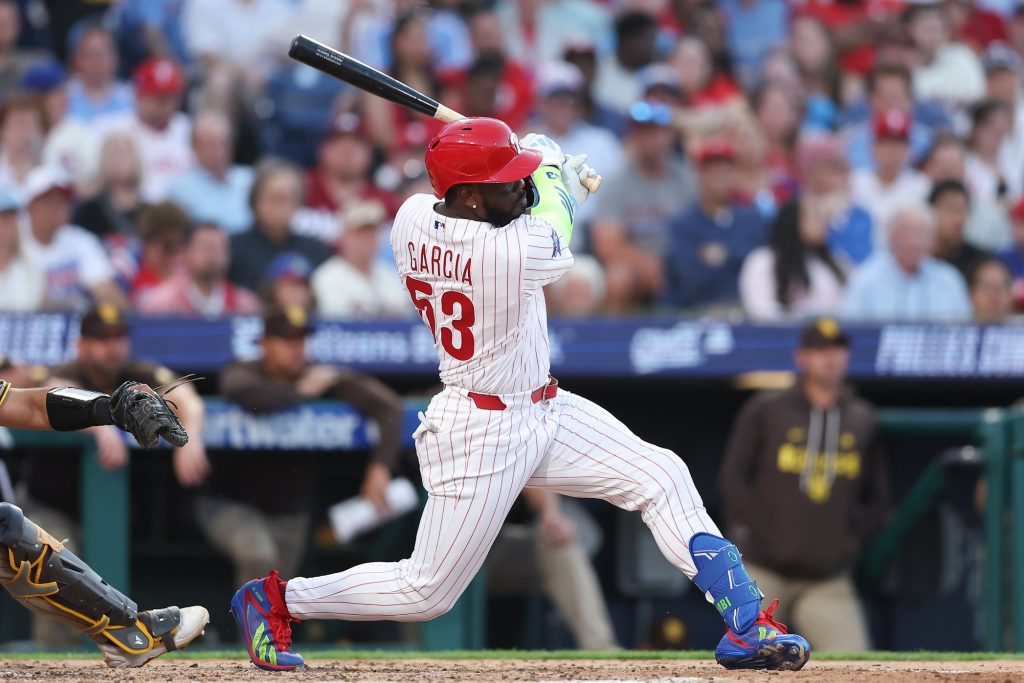 Jun 3, 2026; Philadelphia, Pennsylvania, USA; Philadelphia Phillies right fielder Adolis Garcia (53) hits an RBI double against the San Diego Padres during the fifth inning at Citizens Bank Park.