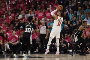 Jun 3, 2026; San Antonio, Texas, USA; New York Knicks guard Jalen Brunson (11) shoots the ball past San Antonio Spurs forward Julian Champagnie (30) in the second half during game one of the 2026 NBA Finals at Frost Bank Center.