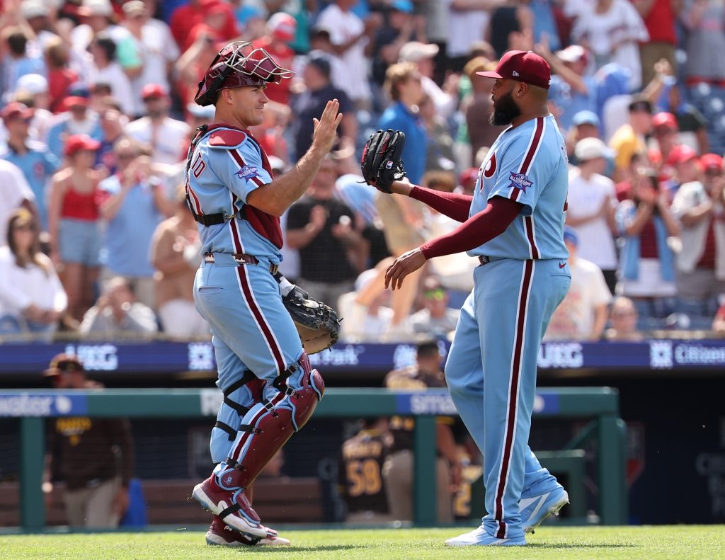 Jun 4, 2026; Philadelphia, Pennsylvania, USA; Philadelphia Phillies catcher J.T. Realmuto (10) and pitcher Jose Alvarado (46) high five after a victory against the San Diego Padres at Citizens Bank Park.