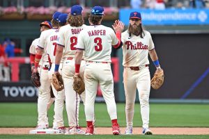 Jun 7, 2026; Philadelphia, Pennsylvania, USA; Philadelphia Phillies left fielder Brandon Marsh (16) celebrates win against the Chicago White Sox with teammates at Citizens Bank Park.