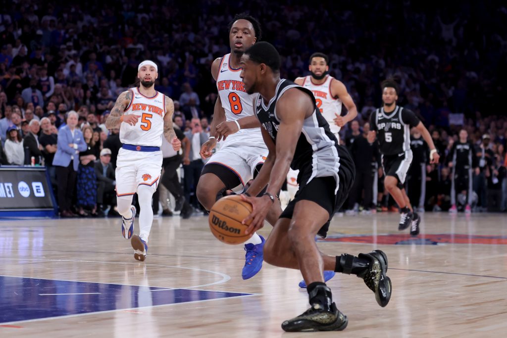 Jun 10, 2026; New York, New York, USA; San Antonio Spurs guard De'aaron Fox (4) drives to the basket against New York Knicks forward OG Anunoby (8) during the fourth quarter of game four of the 2026 NBA Finals at Madison Square Garden.