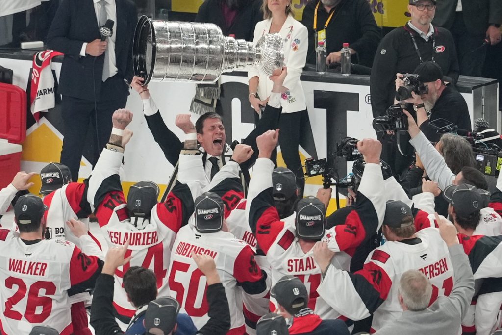 Jun 14, 2026; Las Vegas, Nevada, USA; Carolina Hurricanes head coach Rod Brind'Amour celebrates holding the Stanley Cup after the win against the Vegas Golden Knights in game six of the 2026 Stanley Cup Final at T-Mobile Arena.