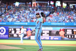 Jun 18, 2026; Philadelphia, Pennsylvania, USA; Philadelphia Phillies pitcher Aaron Nola (27) gets a new baseball after allowing a home run during the first inning against the New York Mets at Citizens Bank Park.
