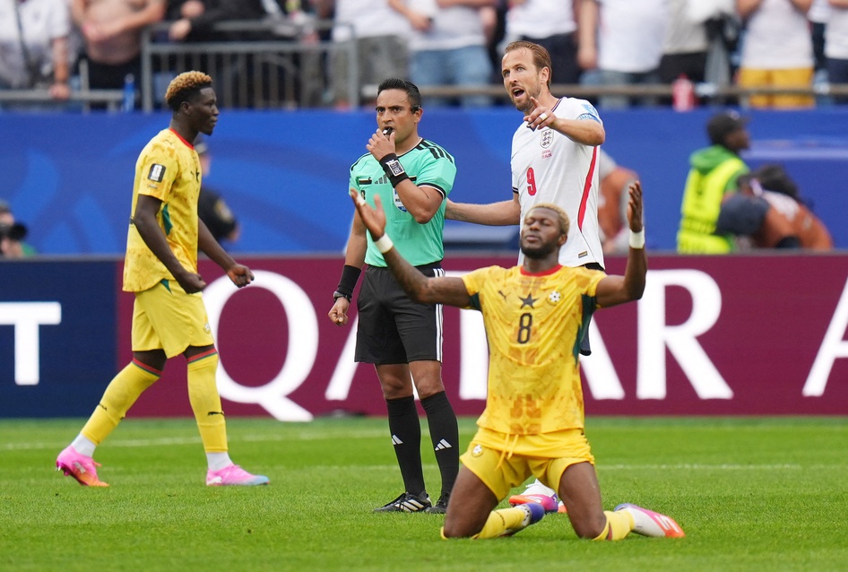 June 23, 2026; Foxborough, Massachusetts, U.S.; Ghana's Kwasi Sibo celebrates as England's Harry Kane talks to referee Said Martinez after the match.