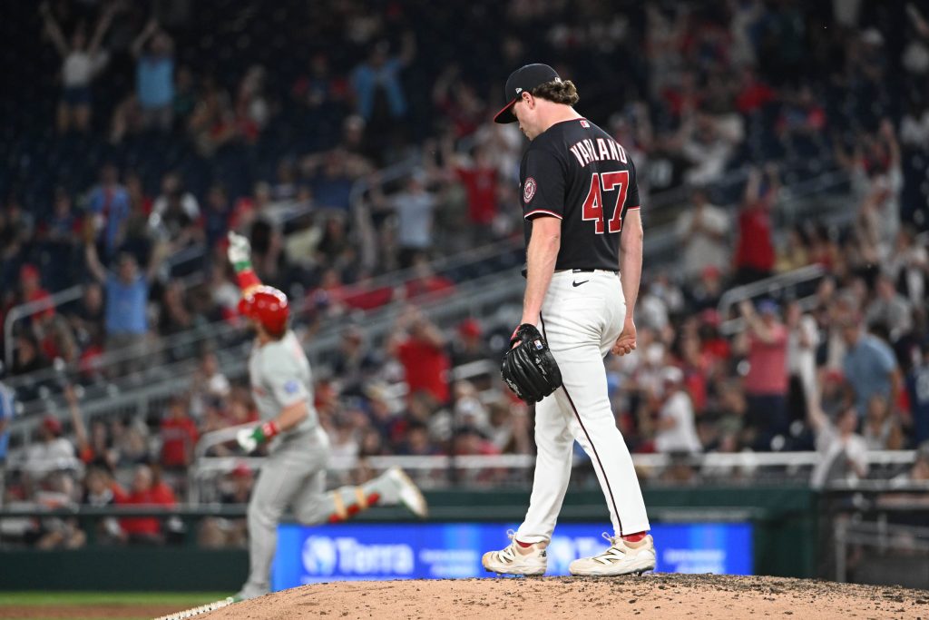 Jun 25, 2026; Washington, District of Columbia, USA; Washington Nationals pitcher Gus Varland (47) reacts after giving up a two run home run to Philadelphia Phillies first baseman Bryce Harper (3) during the ninth inning at Nationals Park.